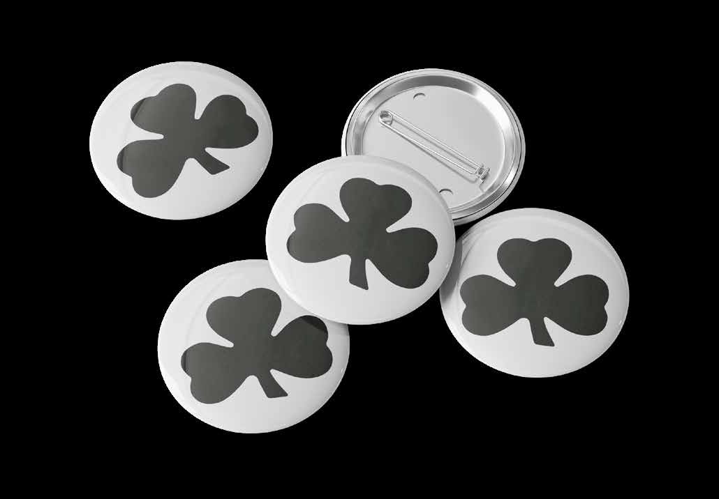 A set of Black Shamrock badges