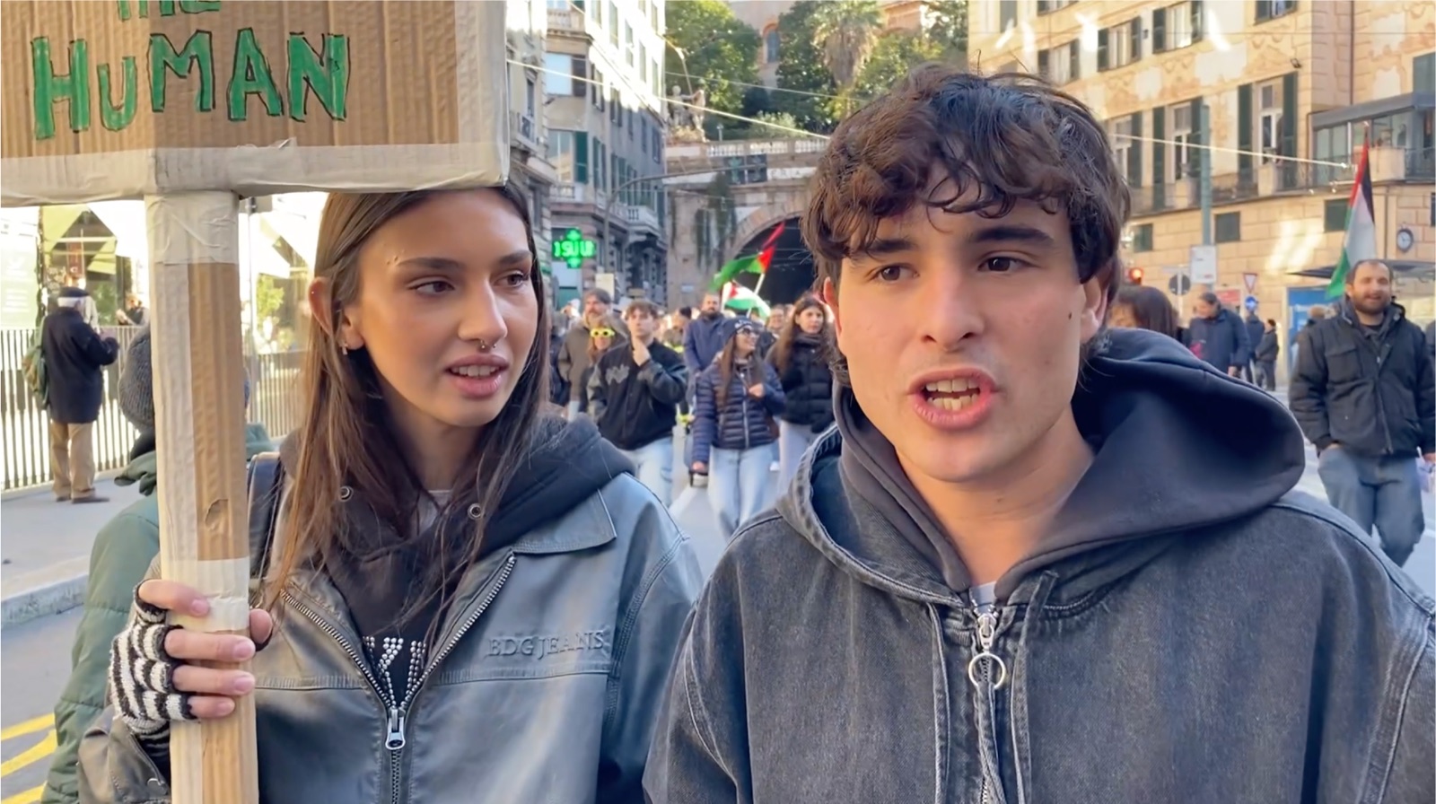 Two young campaigners speaking at a demonstration